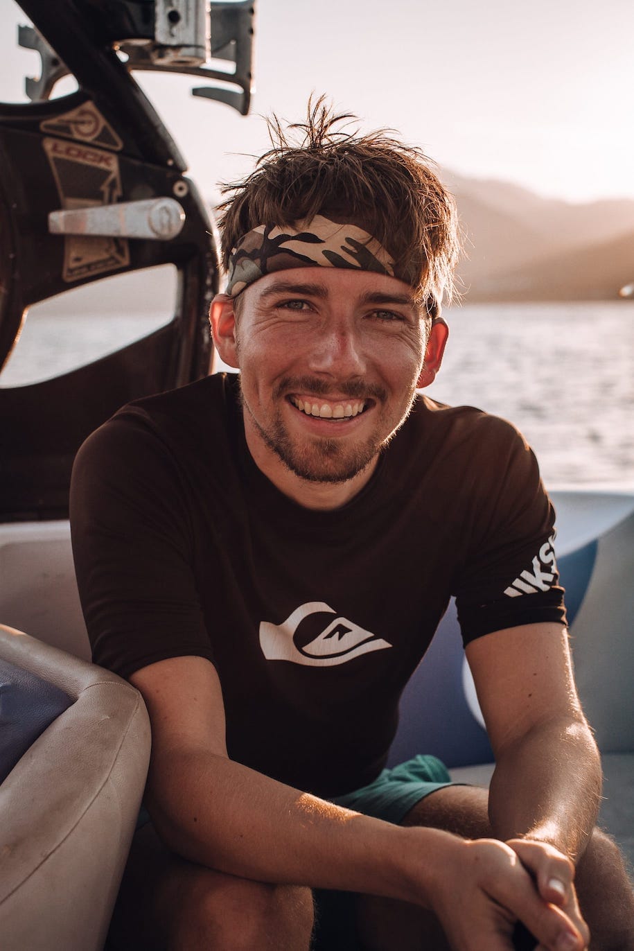 A picture of me sitting on a boat and smiling at the camera